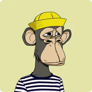 A sad-looking ape with dark grey fur, wearing a yellow rain cap and a striped shirt