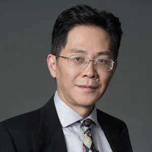 Headshot photograph of Bo Shen, wearing a suit