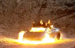A still frame of a Lamborghini mid-explosion