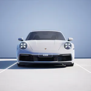 A photo of a white Porsche 911, pictured from the front on